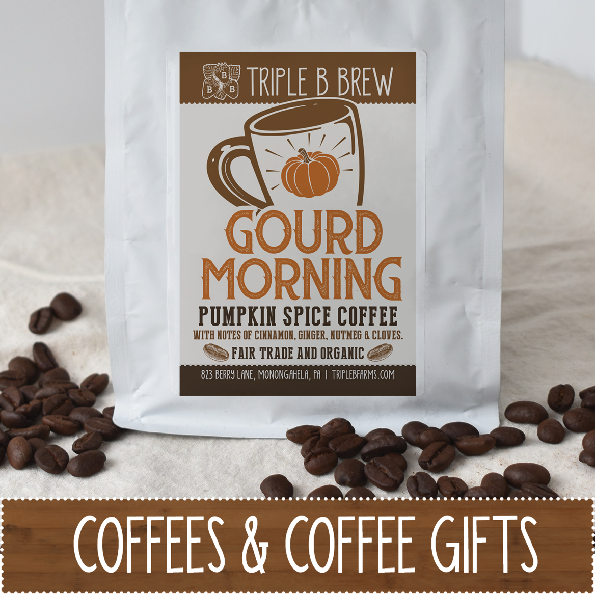 A bag of pumpkin spice coffee labeled "Gourd Morning" with coffee beans scattered around it.